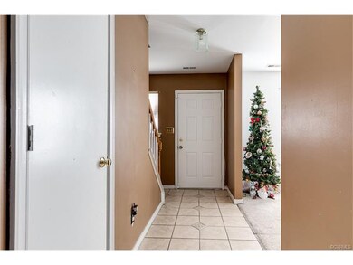 Entry has ceramic tile floors, overhead light, a c