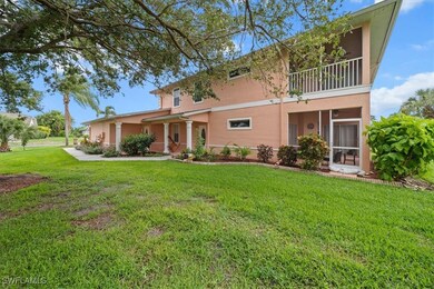 View of front of home with stucco siding, a balcon