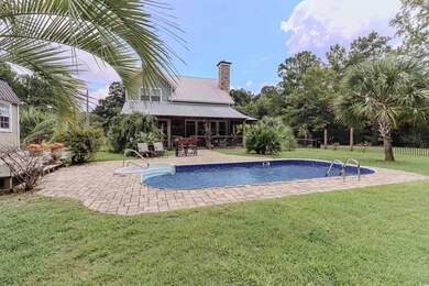 View of swimming pool featuring a patio area and a