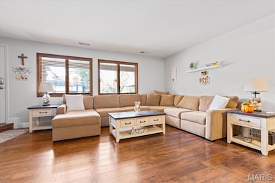 Living room with wood-type flooring