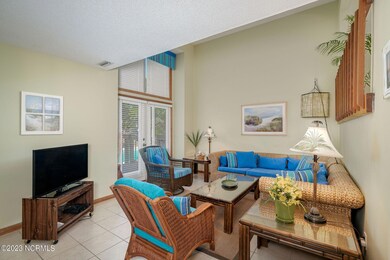 Open living room w/ pool views