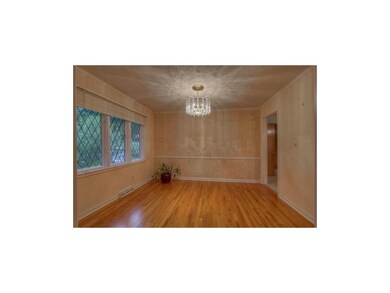 Formal dining room w/ loads of natural light & har