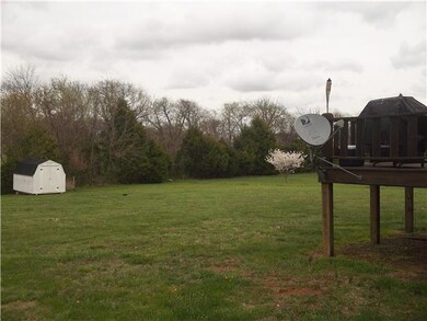 Nice big back yard and storage building.