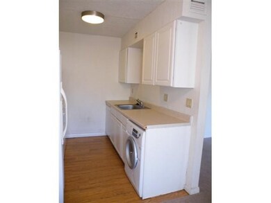 Kitchen w washer and dryer