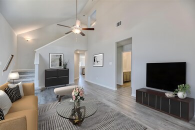 The gleaming vinyl plank flooring introduces a contemporary touch, offering both easy maintenance and durability, making it ideal for daily living and hosting gatherings.