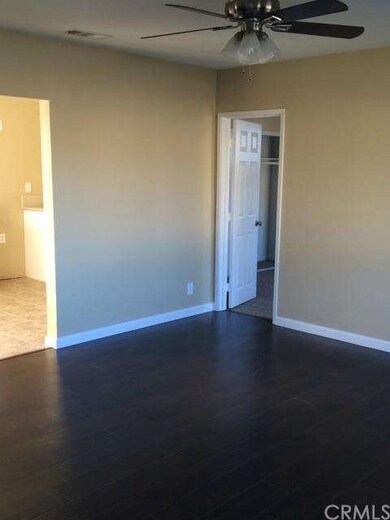 The living room features new stylish laminate floo