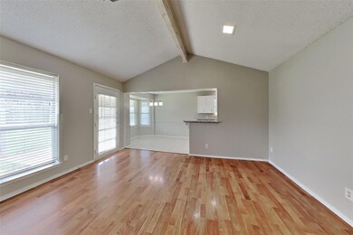 Unfurnished living room with a textured ceiling, l