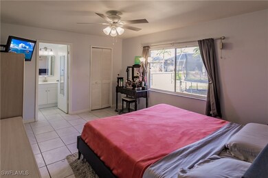 Bedroom featuring ceiling fan, light tile patterne
