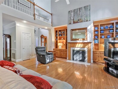 Built in bookcases and cabinets surround the gas f