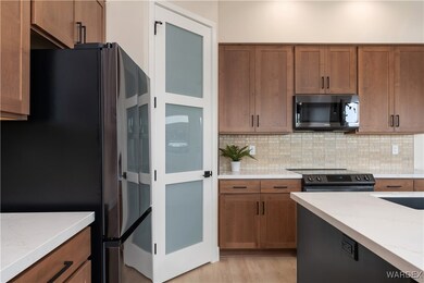 Kitchen featuring electric range oven, decorative