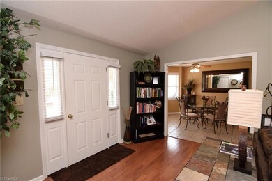 The sunny entry opens to the living room and breakfast area.