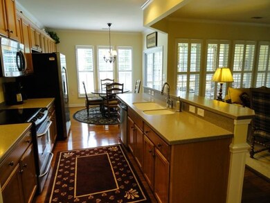 Kitchen wth hardwood floors, pull out drawers, upgraded knobs on all cabinets, stainless steel appliances,  Pantry Built-ins by California Closets and Kholer sink fixture. 