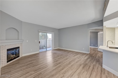 Unfurnished living room featuring light wood-style