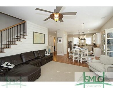 Living Room. The hidden stairway leads to three be