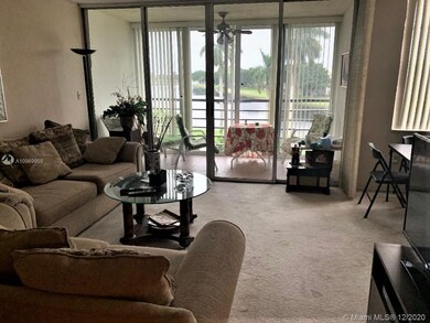 LIVING ROOM OVERLOOKS LAKE.
