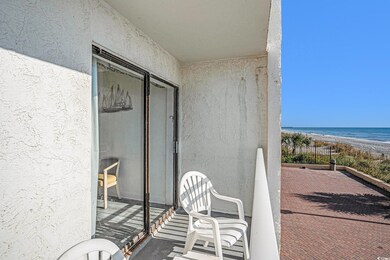 Balcony with view of water and beach