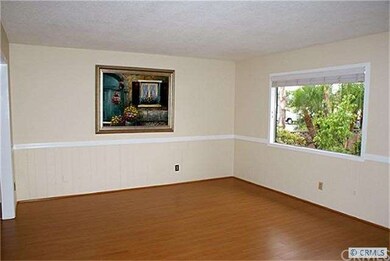 LIVING ROOM with laminate wood floor, 2-tone paint