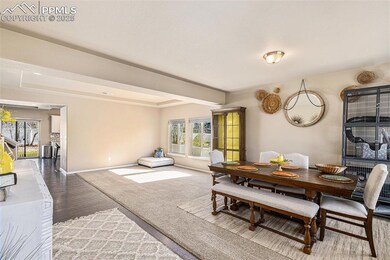 Dining room with baseboards and wood finished floo