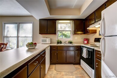 Renovated kitchen with refurbished cabinets and pl