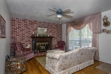 Living Room with Wood Burning Fireplace with Blowe