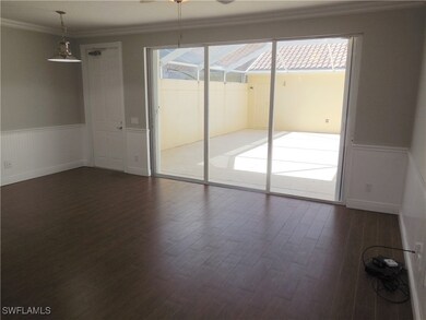 Spare room with dark wood-type flooring, ornamenta