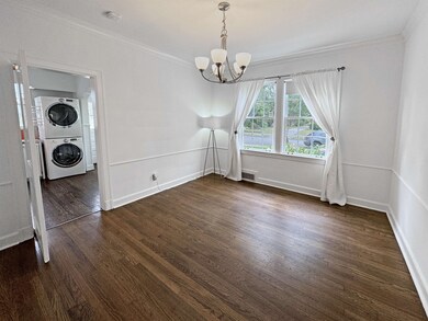 Unfurnished room with stacked washer / dryer, a no