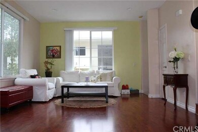 The living room with gleaming laminate floors and 