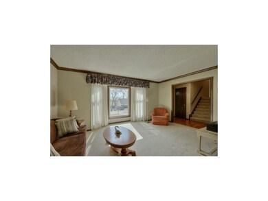View of living room looking back at entry