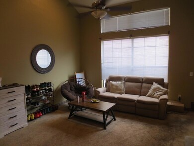 Living room with a wealth of natural light, a ceil