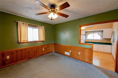 Large dining room that opens up into the kitchen.