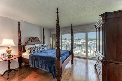 Master Bedroom with sliders to the balcony and wat