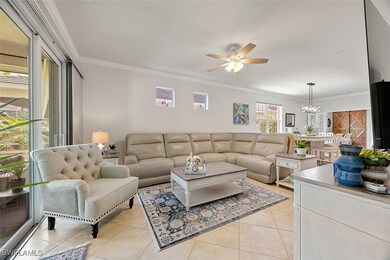 Living room featuring ceiling fan with notable cha