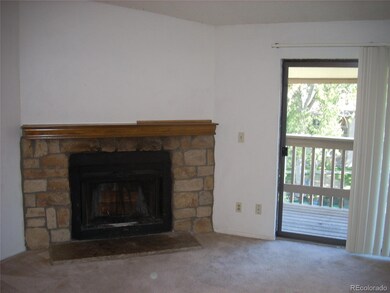 Family room with wood burning fireplace and access