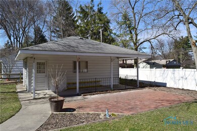 One-car, detached garage with covered patio as wel