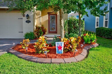 Lush Lawn, covered porch entry.