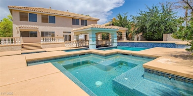 View of pool featuring a patio, an in-ground hot tub, and a gazebo
