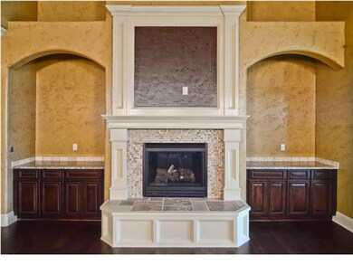 Custom fireplace with plenty of built-in space ove