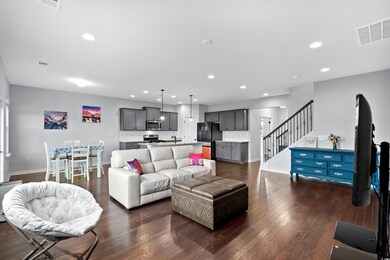 Living room with dark hardwood / wood-style floori