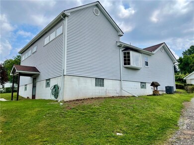 A side view of the house. The alley to the right p