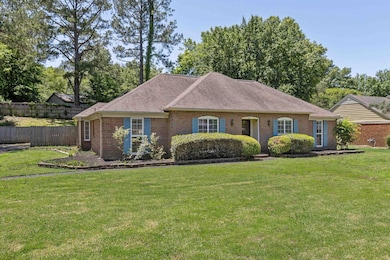 Single story home featuring brick siding and a shingled roof