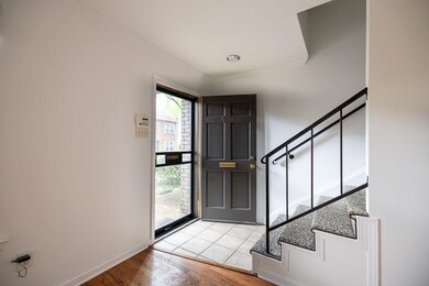 Foyer featuring light wood-type flooring and ornam