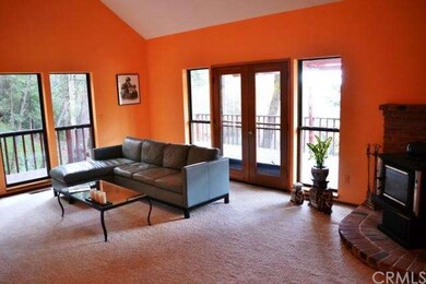 The light and bright living room has soaring ceili