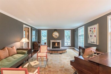 Grand living room with marble fireplace surround