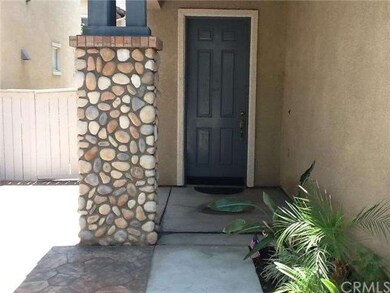 Lovely stamped concrete in front courtyard leading