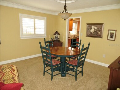 Formal dining room features crown molding.