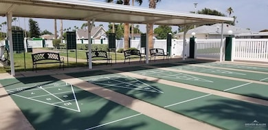 View of community with a residential view and shuffleboard