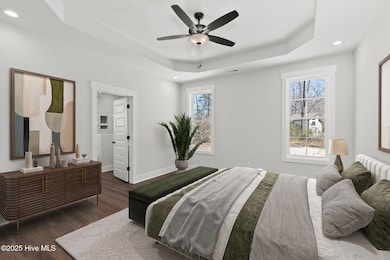 First Floor Primary w/ Tray Ceilings