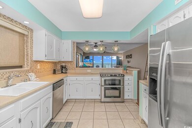 Kitchen with appliances with stainless steel finis
