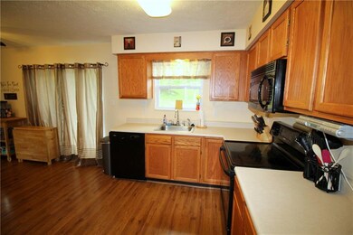 The kitchen has a breakfast nook with sliding door