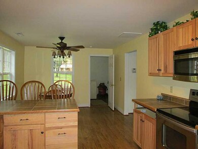 Kitchen. Looking into laundry with door open